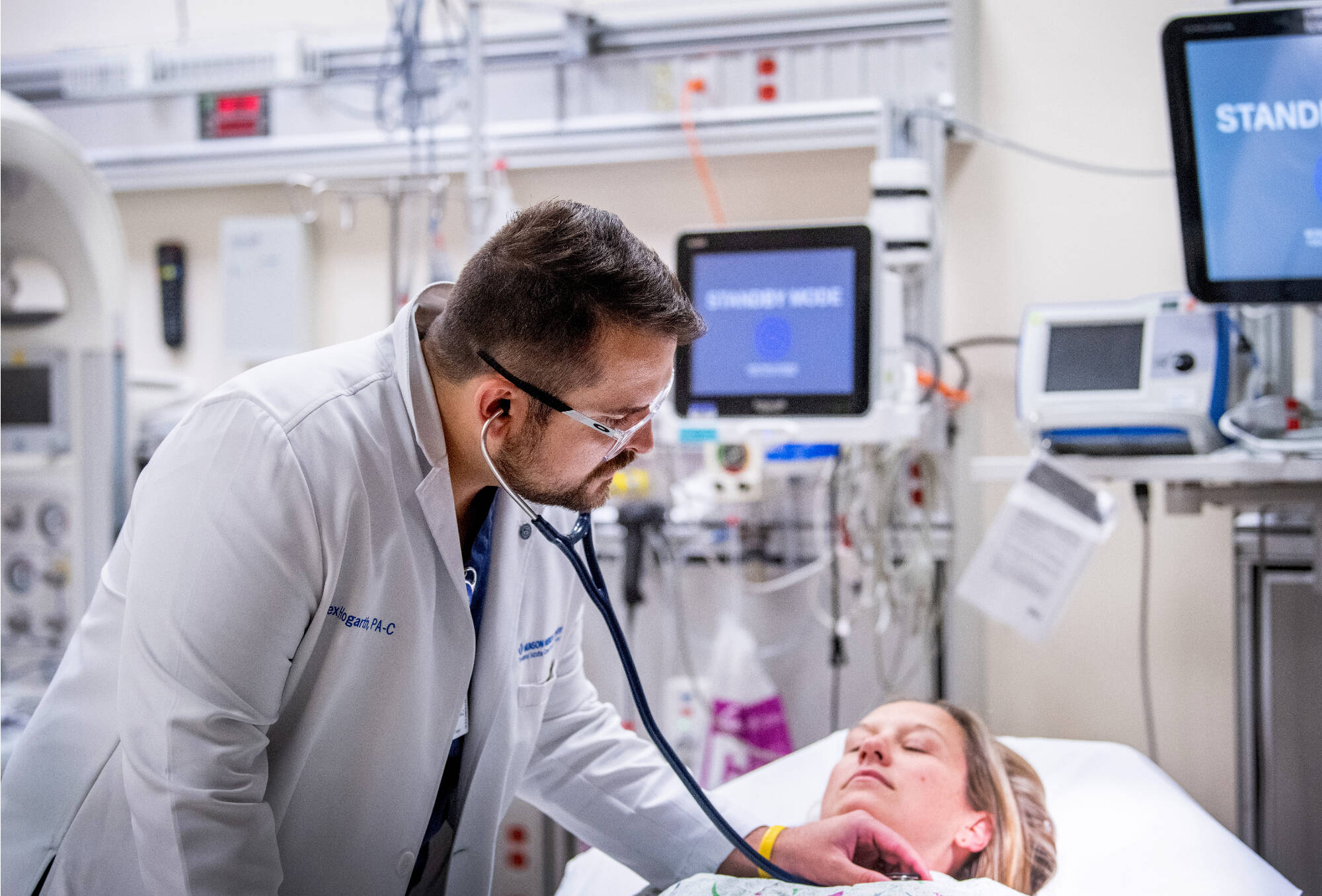 Man checking women's heart beat